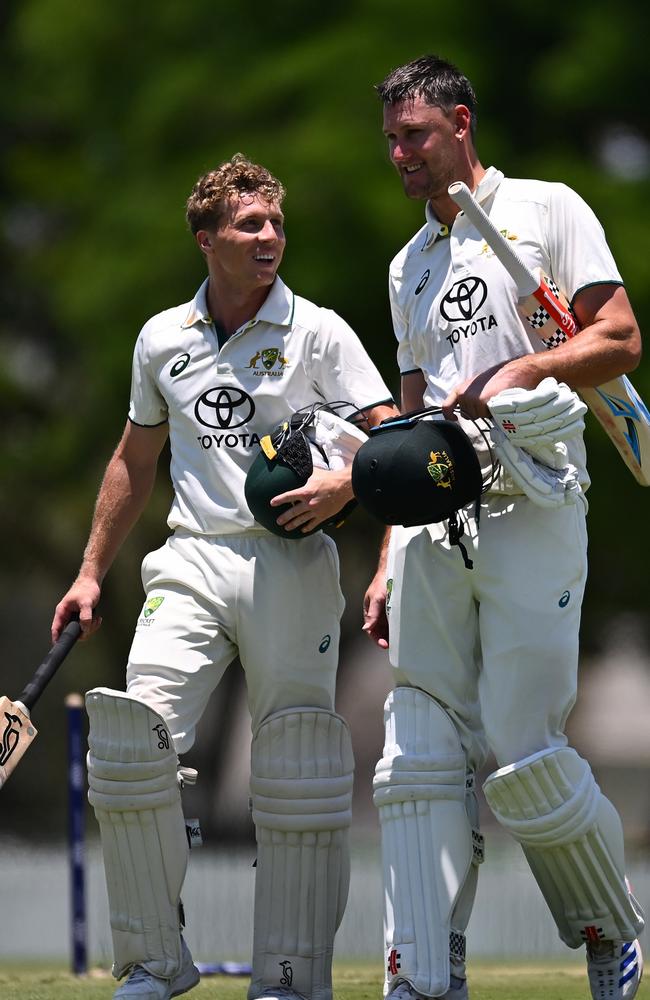 Nathan McSweeney and Beau Webster walk off the field at Great Barrier Reef Arena. Picture: Albert Perez/Getty Images.