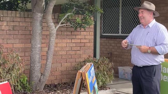 Independent candidate Jack Dempsey handing out voting cards at the Totness Street booth in Hervey Bay.