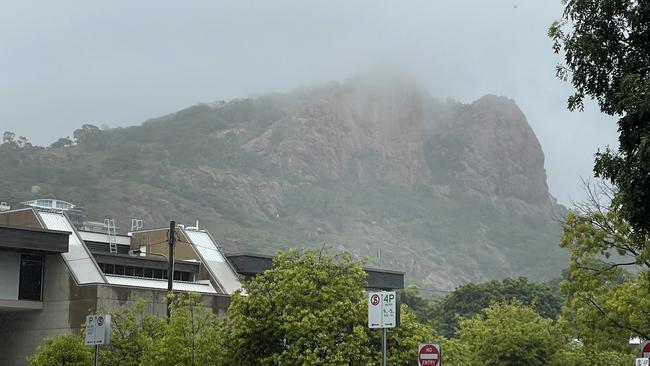 Cloud shrouding Castle Hill as rain sweeps into Townsville on New Year's Day 2023. Picture: Leighton Smith