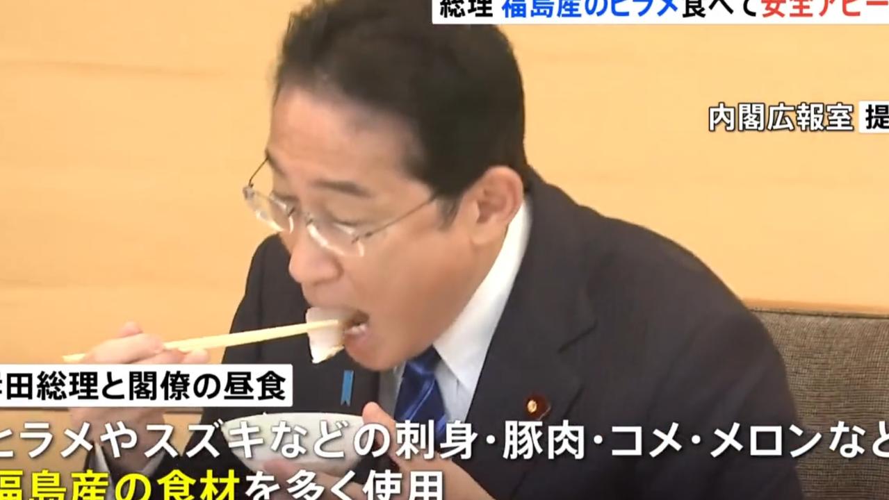 Fumio Kishida eats seafood from Fukushima. Picture: @nexta_tv/Twitter