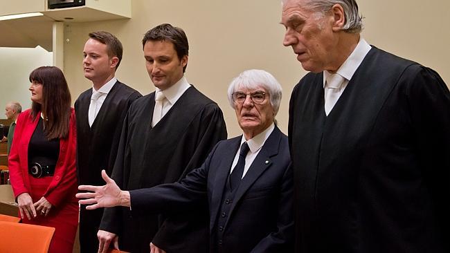 Bernie Ecclestone, second right, with his lawyers at the start of his bribery trial in Mu