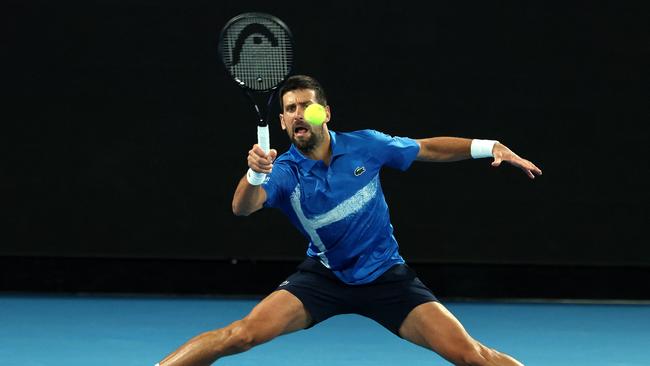 Serbia's Novak Djokovic hits a return against USA's Nishesh Basavareddy during their men's singles match on day two of the Australian Open tennis tournament in Melbourne on January 13, 2025. (Photo by DAVID GRAY / AFP)