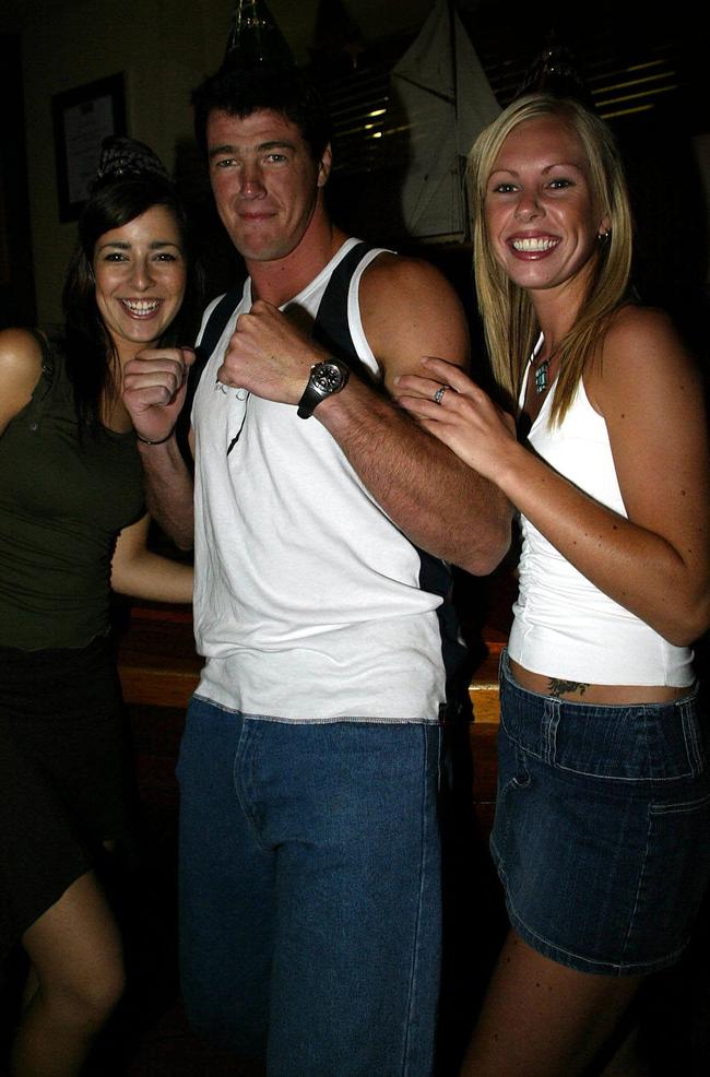 Marina Pesa, 24, from Greenvale (left) and Liane Murray, 24, from Roxburgh Park, test the muscles of Australian Amateur Boxing Heavyweight Champ Brad Pitt at the Portsea Hotel.