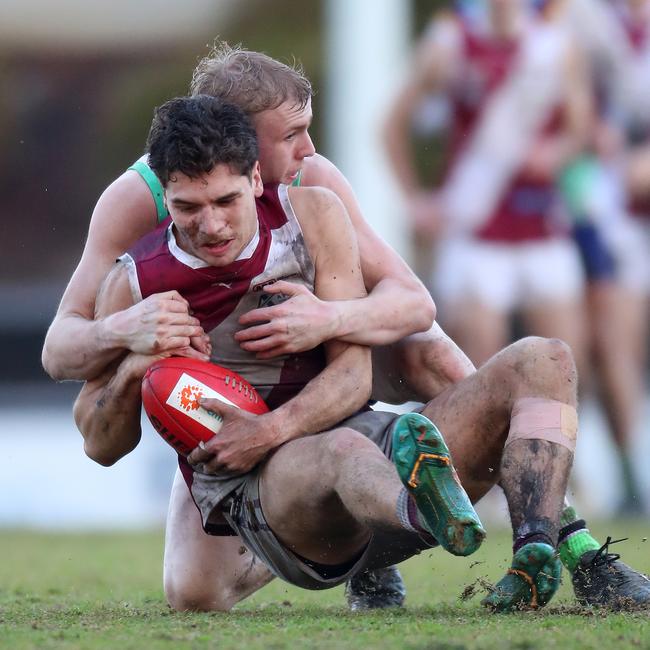 Traralgon’s Luis D'Angelo is brought down in a tackle against Moe.