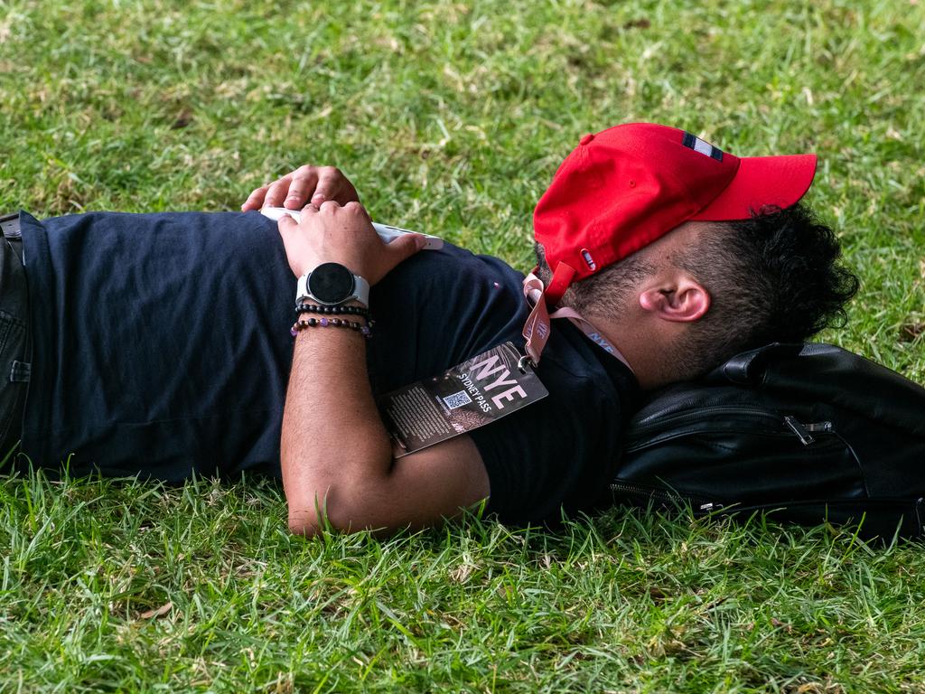 Many revellers had a sleep on the sand or grass after ringing in the New Year. Picture Thomas Lisson