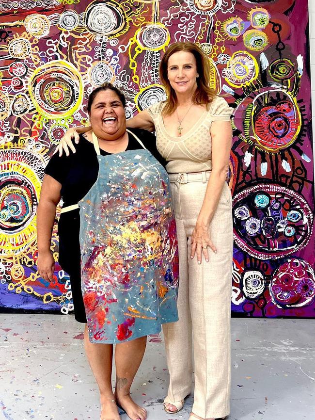 Actor Rachel Griffiths visits APY Arts Centre. There is no suggestion the art in this picture has been interfered with. Picture: Facebook/Supplied