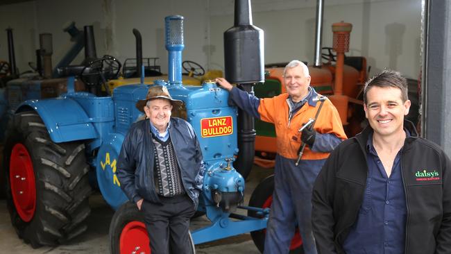 Alan Bailey, Gunter Tippner and Evan Mulcahy with a restored Lanz Bulldog Tractor. Picture: Yuri Kouzmin