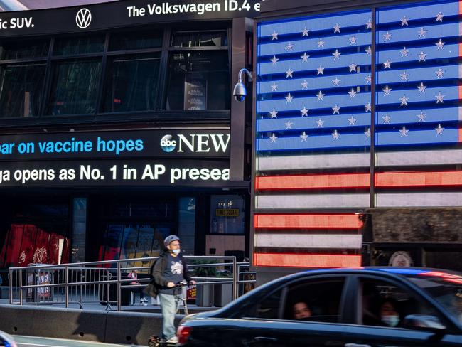 NEW YORK, NY - NOVEMBER 09: An electronic billboard in Times Square announces "stocks soar on vaccine hopes" on November 9, 2020 in New York City. Pharmaceutical company Pfizer announced positive early results on its COVID-19 vaccine trial and has proven to be 90% effective in preventing infection of the virus.   David Dee Delgado/Getty Images/AFP == FOR NEWSPAPERS, INTERNET, TELCOS & TELEVISION USE ONLY ==