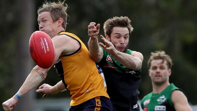 Strathmore star Luke Jarrad and Greenvale champ Nick Maric do battle last season. Picture: Mark Dadswell