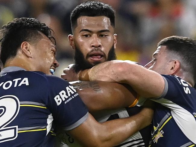 TOWNSVILLE, AUSTRALIA - JULY 02:  Payne Haas of the Broncos is tackled by Jeremiah Nanai and Chad Townsend of the Cowboys during the round 16 NRL match between the North Queensland Cowboys and the Brisbane Broncos at Qld Country Bank Stadium, on July 02, 2022, in Townsville, Australia. (Photo by Ian Hitchcock/Getty Images)