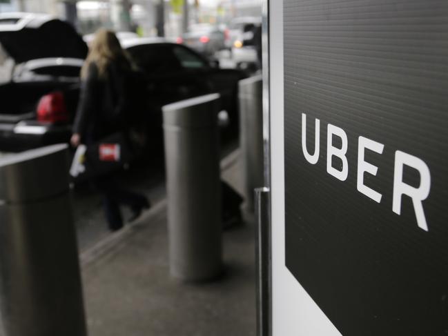 FILE - In this March 15, 2017, file photo, a sign marks a pick up point for the Uber car service at LaGuardia Airport in New York. The Justice Department in Manhattan is investigating whether Uber illegally used software to track drivers for Lyft, its main ride-hailing competitor, to gain an advantage in attracting and recruiting drivers, according to two people familiar with the probe. The FBI and the U.S. Attorneyâ€™s Office in New Yorkâ€™s Southern District want to know if use of the software, which created fake customer accounts, broke any federal laws, said the people, who didnâ€™t want to be identified because they were not authorized to discuss the case publicly. An Uber spokeswoman said Friday, Sept. 8 it is cooperating in the probe and that use of the software has been discontinued. The U.S. Attorneyâ€™s Office would not comment on the case. (AP Photo/Seth Wenig, File)