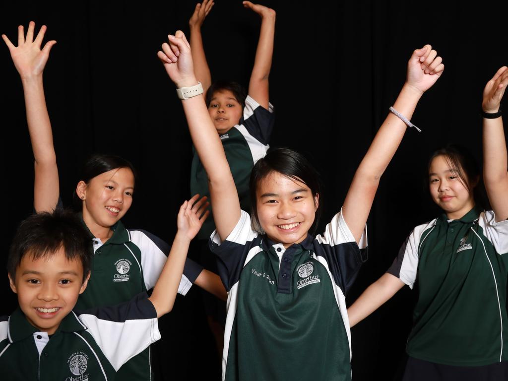 Abigail, centre, said classmates and friends at Oberthur Primary School are helping her celebrate her win. Picture: Philip Gostelow