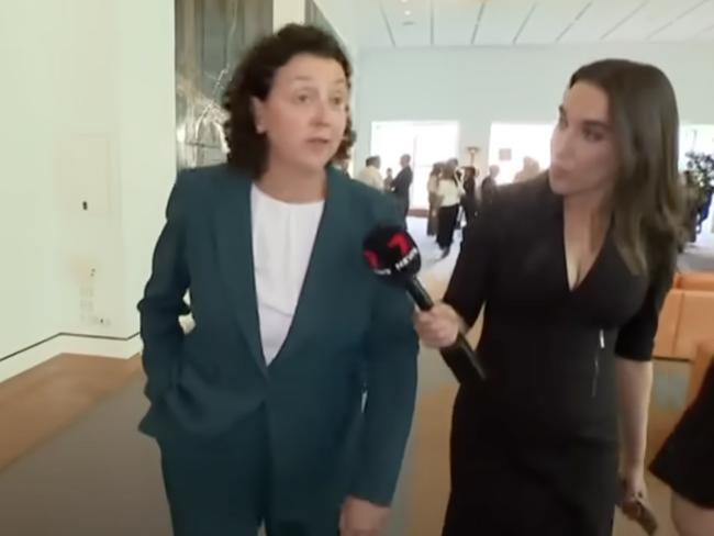 Monique Ryan snapped at a reporter asking about her husband's theft of her rival's political signage before fleeing.