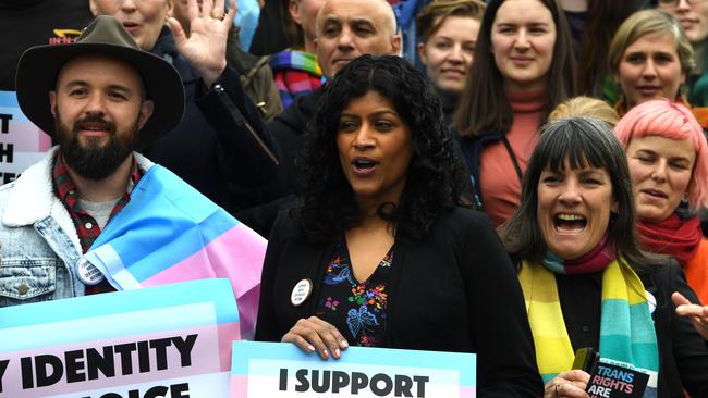 Victorian Greens leader Samantha Ratnam (centre) is seen with supporters of the gender diverse birth certificate bill outside of the Victorian State Parliament in Melbourne. (AAP Image/James Ross)