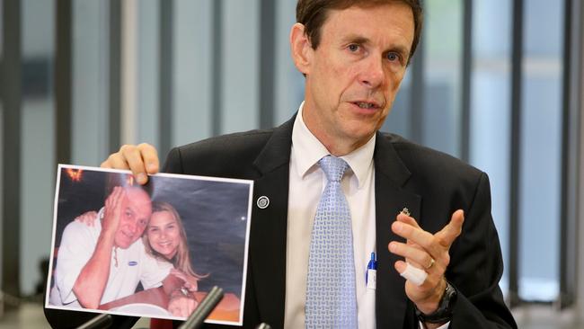 Queensland Detective Supt David Hutchinson with a picture of suspected murder victim David Hanson. Picture: Jono Searle