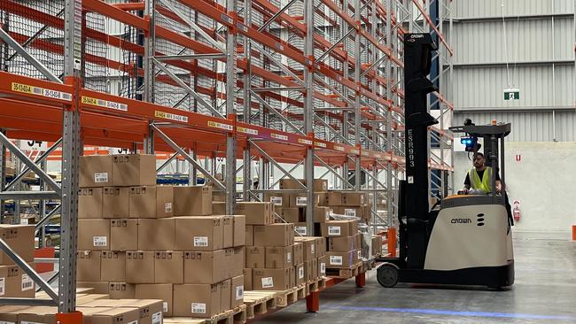 Workers at L’Oreal Groupe Queensland Distribution Centre in Redbank, Ipswich on Wednesday. Picture: Grace Koo