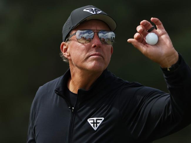 AUGUSTA, GEORGIA - APRIL 09: Phil Mickelson of the United States catches a ball on the 18th green during the continuation of the weather delayed third round of the 2023 Masters Tournament at Augusta National Golf Club on April 09, 2023 in Augusta, Georgia. (Photo by Patrick Smith/Getty Images)