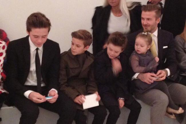 The Beckham family sits front row at Victoria Beckham s show