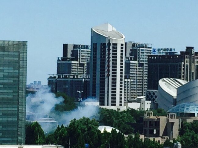 Smoke rises in the vicinity of the US Embassy in Beijing.