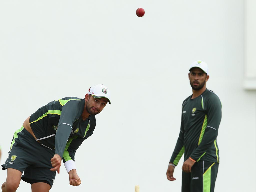 Nathan Lyon is watched by spin hopeful Fawad Ahmed on the 2015 tour of the West Indies. Picture: Getty