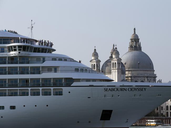 Critics of large ships in the lagoon city of Venice say ocean liners do not belong there and create waves that erode the foundations of the city. Picture: AP