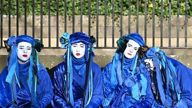 Performers from the Blue Rebels prepare to participate in a ‘funeral ceremony’ to symbolise the ‘failure’ of the COP26 process, in Glasgow. Picture: Paul Ellis/AFP