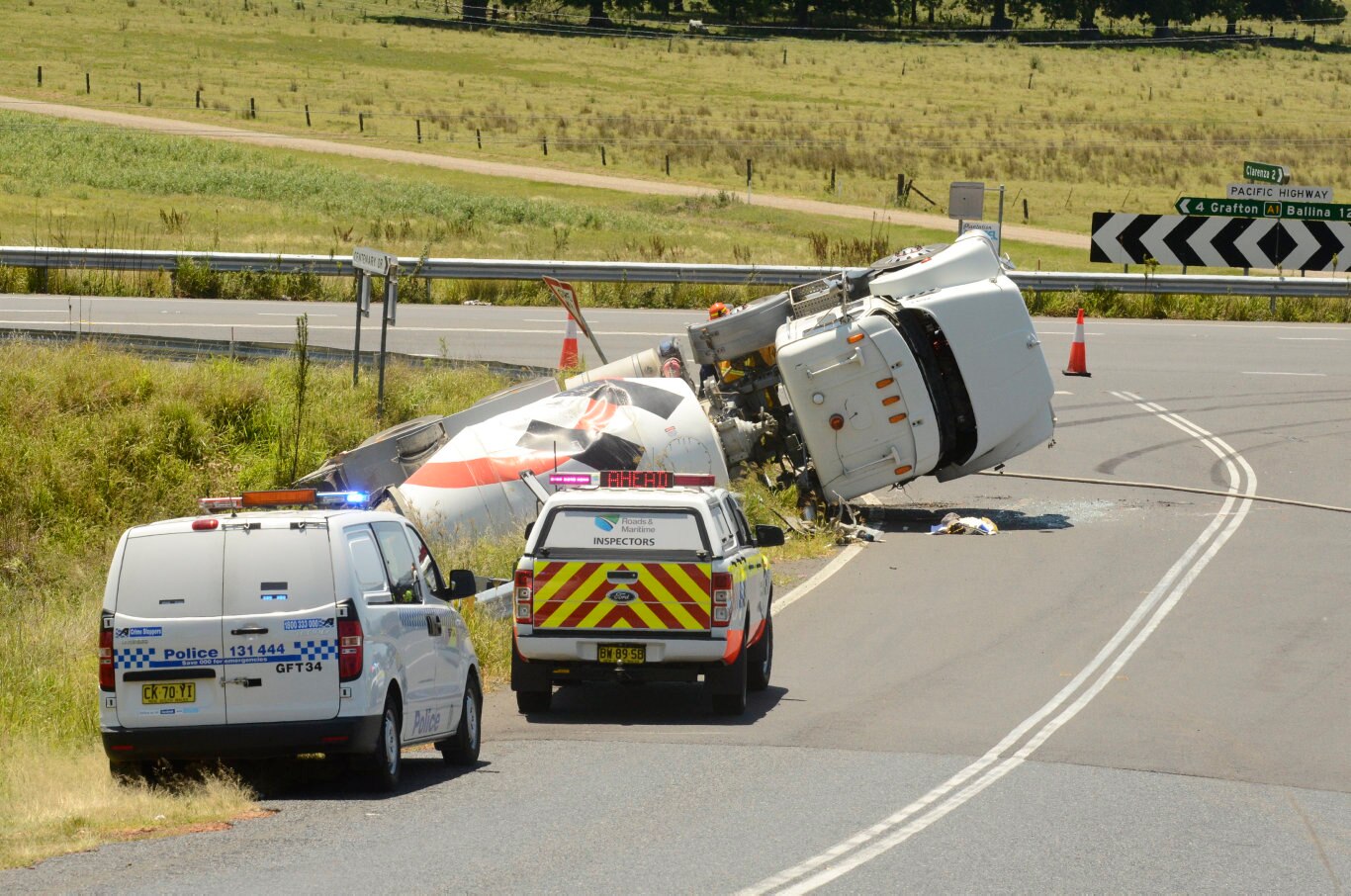 A cement truck came to rest in a ditch near the Pacific Highway, Centenary Drive intersection, north of Grafton, NSW. Picture: Jarrard Potter