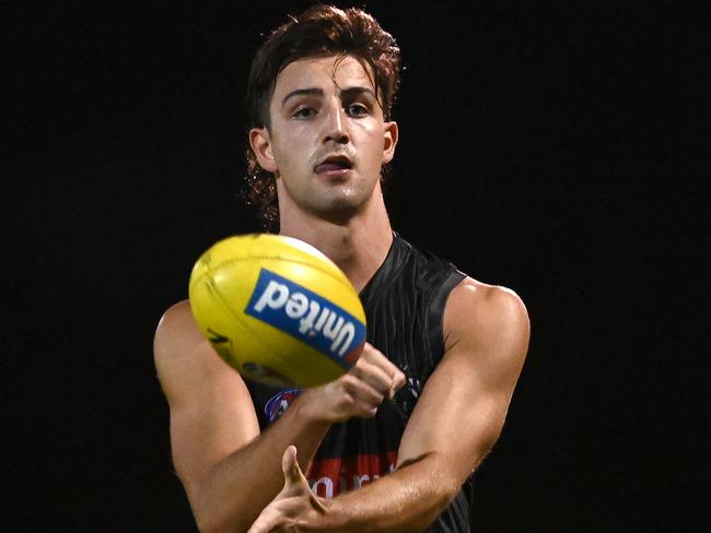 SUNSHINE COAST, AUSTRALIA - OCTOBER 08: Josh Daicos of the Magpies handballs during a Collingwood Magpies AFL training session at Maroochydore Multi Sports Complex on October 08, 2020 in Sunshine Coast, Australia. (Photo by Quinn Rooney/Getty Images)