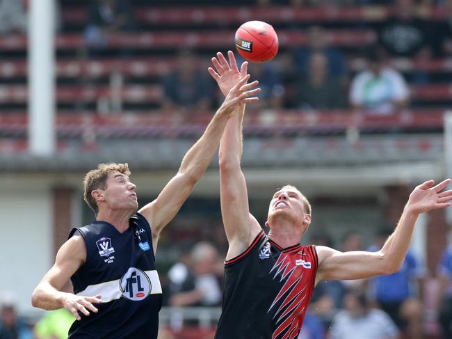 Photo: Hamish Blair Matthew Dennis (left) of NFL contests ruck against Andrew Browne of EDFL during the EDFL v NFL Metro Championship match played at Princes Park on Saturday, March 29, 2014 in Melbourne, Australia