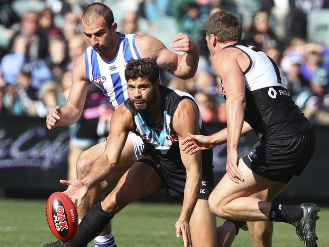 Port Adelaide’s Paddy Ryder taps the ball out to Brad Ebert. Picture: SARAH REED