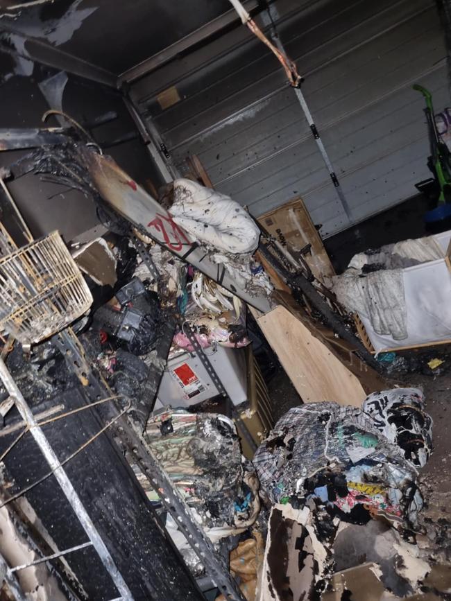 Firefighters found that a lawnmower battery had exploded, causing the fire and destroyed the family’s garage along with many valuable items. Picture: Supplied