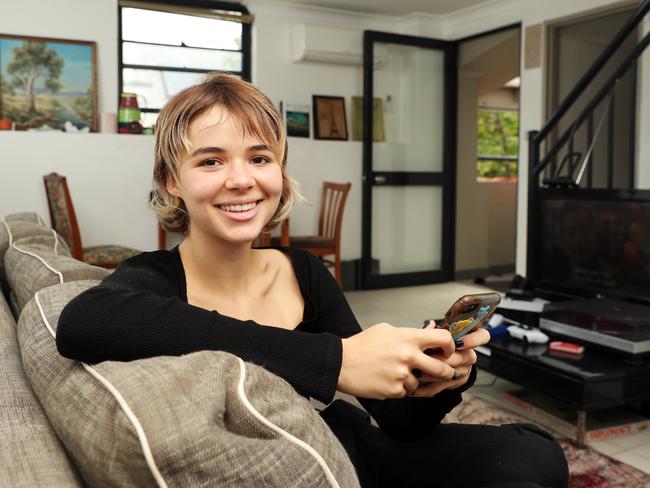 Pictured at home in Sydney, Mischa Byrne, 19, said in her busy household, captions allowed her stay focused on TV show. Picture: Tim Hunter.