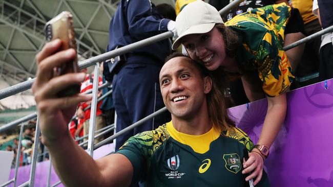 Christian Lealiifano poses for a selfie with fans.