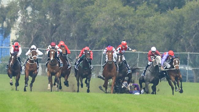 Jockey Andrew Adkins was concious and talking to ambulance officers after crashing to the turf on Hot ‘N’ Hazy at Rosehill Gardens. Picture: Getty Images