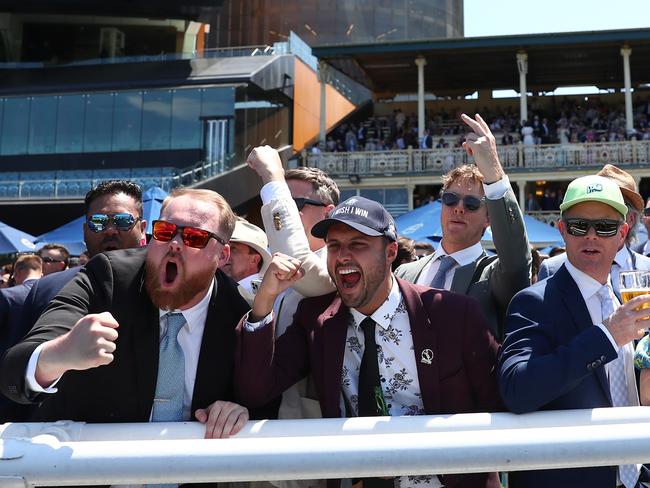 Racegoers cheer in Race 1 Moet &amp; Chandon St Leger Stakes. Picture: Getty Images