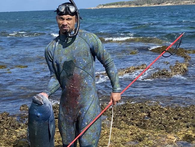 A group of Cronulla swimmers who were deeply saddened by the illegal killing of a blue groper have called for greater protection for marine life in Bate Bay. A man was issued with a $500 on the spot fine from NSW Police and a $300 fine from the Department of Primary Industries when he used a spear to kill a blue grouper at Oak Park Beach on December 30. It is illegal to take a groper by any method other than a line or handline. A group of swimmers, organised by Peter Green, carried out a memorial swim at Oak Park last week dedicated to the fish, who they believe was beloved âGusâ and lived in the area for 30 to 40 years. Picture: Supplied