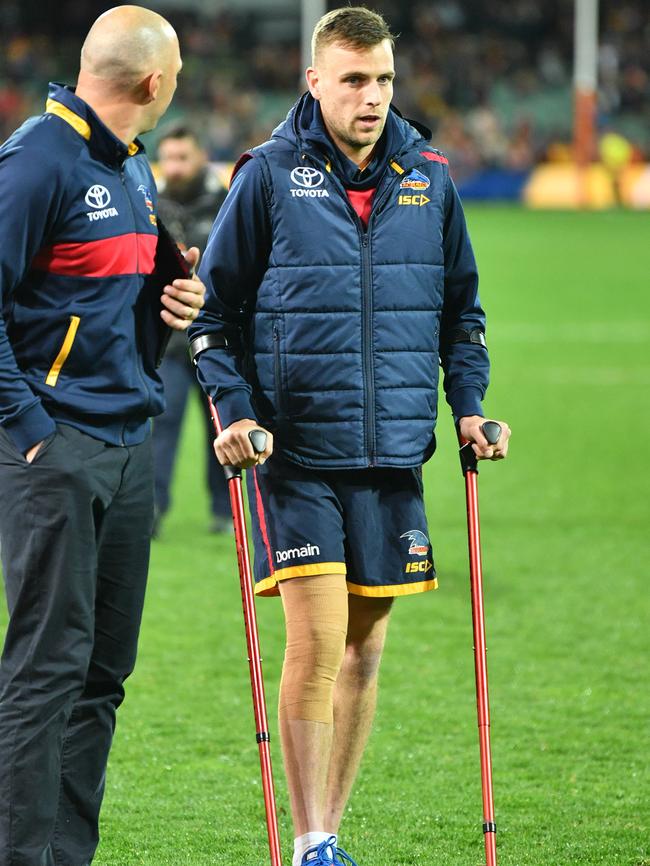 Brodie Smith on crutches after the match. Picture: AAP Image/David Mariuz