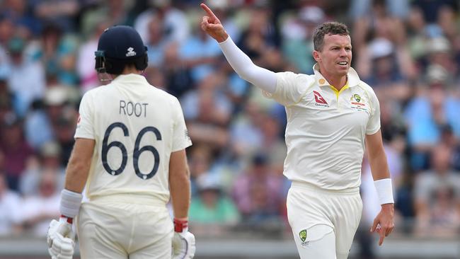 Peter Siddle celebrates the wicket of Joe Root.