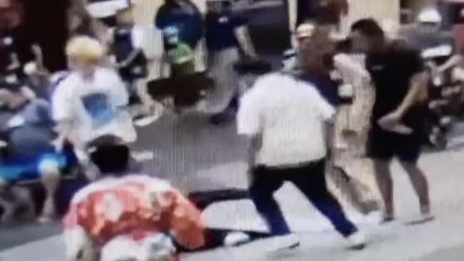 The extraordinary moment a good Samaritan used his hip and shoulder to knock down a thug accused of a violent attack in Rundle Mall. Picture: 7NEWS