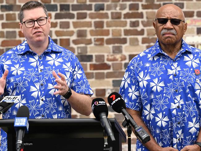 Fiji's Prime Minister Sitiveni Rabuka (R) looks on as Pat Conroy, Australia's Minister for International Development and the Pacific, speaks during an event at the New South Wales Waratahs rugby team headquarters in Sydney on October 16, 2023. Australia and Fiji on October 16 announced the next phase of the PacificAus Sports funding for the Fijian Drua and Fijiana Drua rugby union teams at the NSW Waratahs headquarters. (Photo by Saeed KHAN / AFP) / -- IMAGE RESTRICTED TO EDITORIAL USE - STRICTLY NO COMMERCIAL USE --