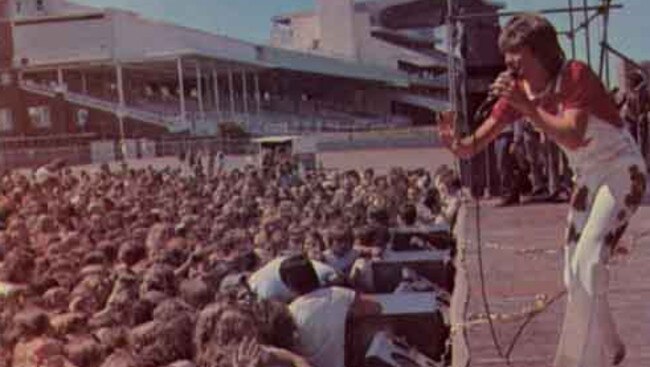 David Cassidy plays at Randwick Racecourse in 1974.