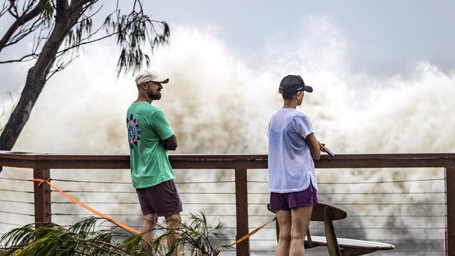 Onlookers watch cyclonic waves at Snapper Rocks. Picture: Nigel Hallett