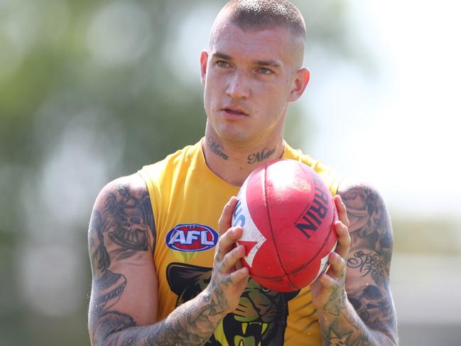 GOLD COAST, AUSTRALIA - JANUARY 30: Dustin Martin handballs during a Richmond Tigers AFL training session at Southport Sharks on January 30, 2020 in Gold Coast, Australia. (Photo by Chris Hyde/Getty Images)