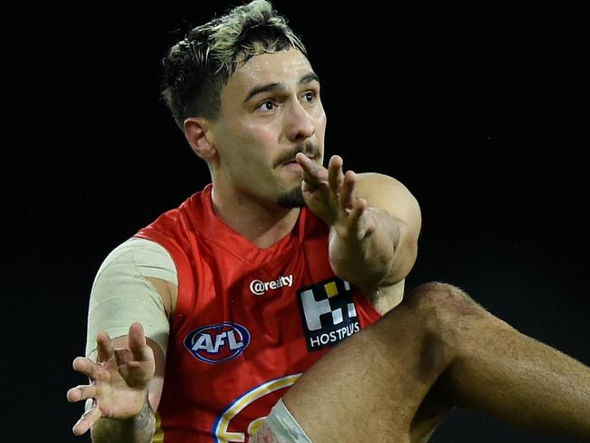 GOLD COAST, AUSTRALIA - AUGUST 12: Izak Rankine of the Suns kicks during the round 11 AFL match between the Gold Coast Suns and the Essendon Bombers at Metricon Stadium on August 12, 2020 in Gold Coast, Australia. (Photo by Matt Roberts/AFL Photos/via Getty Images)