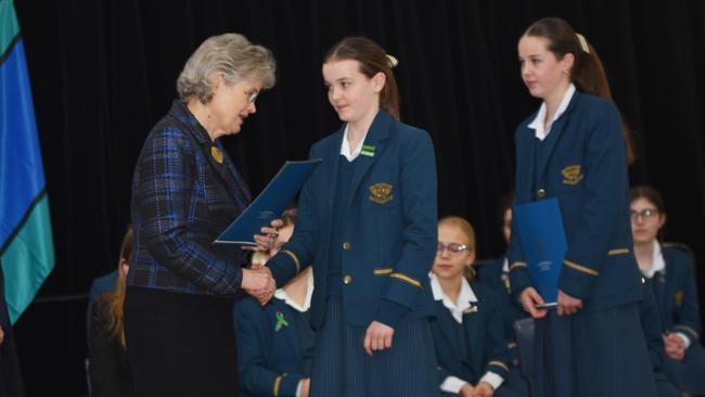 Scarlett Fay accepts her bravery award from the Governor of South Australia, Frances Adamson AC, and Loreto College principal Kylie McCullah. Picture: Supplied