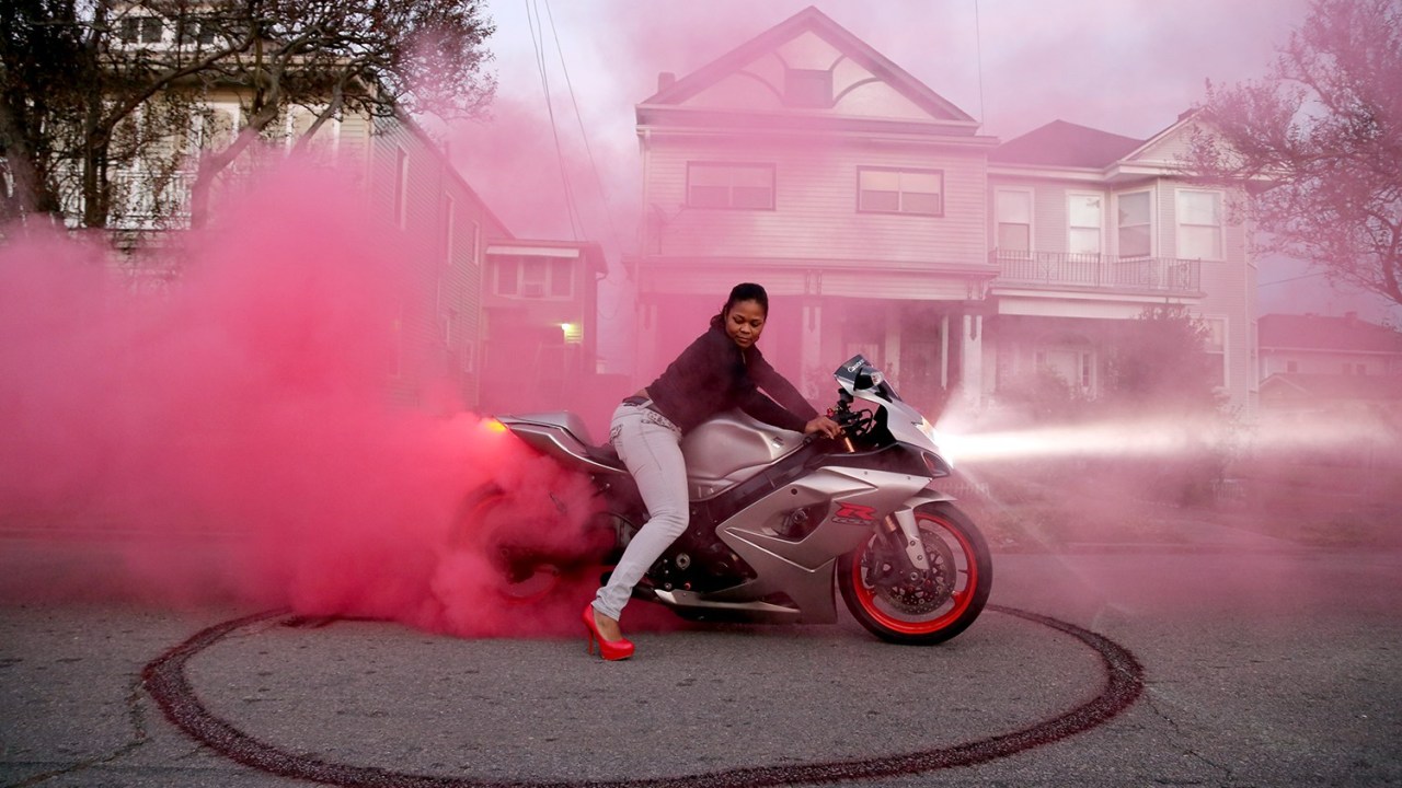 Girl riding outlet pink motorcycle