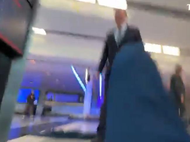 Nine chair Peter Costello has been captured on camera knocking a journalist to the ground during a scuffle at Canberra Airport. Picture: The Australian