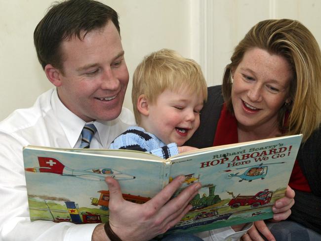 Education Media Promotion The Mercury Free Books for Schools Politics portrait Will Hodgman and wife Nicky read to their delighted son William
