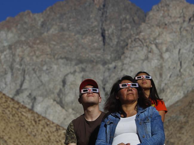 PAIGUANO, CHILE - JULY 02: Chileans watch the sky prior to a total solar eclipse on July 2, 2019 in Paiguano, Chile. Around 25,0000 tourists arrived to Paiguano, a small town of around 1,000 inhabitants in the Elqui Valley, 650 km away Santiago. This is the only Earth's total solar eclipse of 2019 and the first one since 2017. From this point, the sun will fully disappear for around two minutes. It is best visible from a stripe in the South Pacific, Chile and Argentina.  (Photo by Marcelo Hernandez/Getty Images)