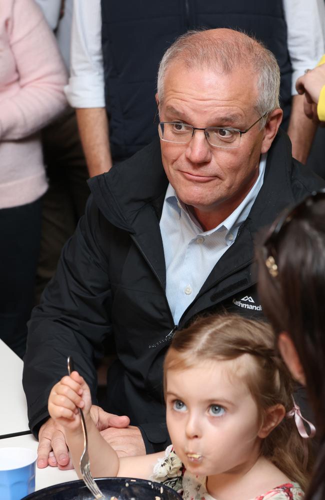 Prime minister Scott Morrison speaks to a family having dinner as he visits the Edgeworth Tavern in Edgeworth, Newcastle. Picture: Damian Shaw